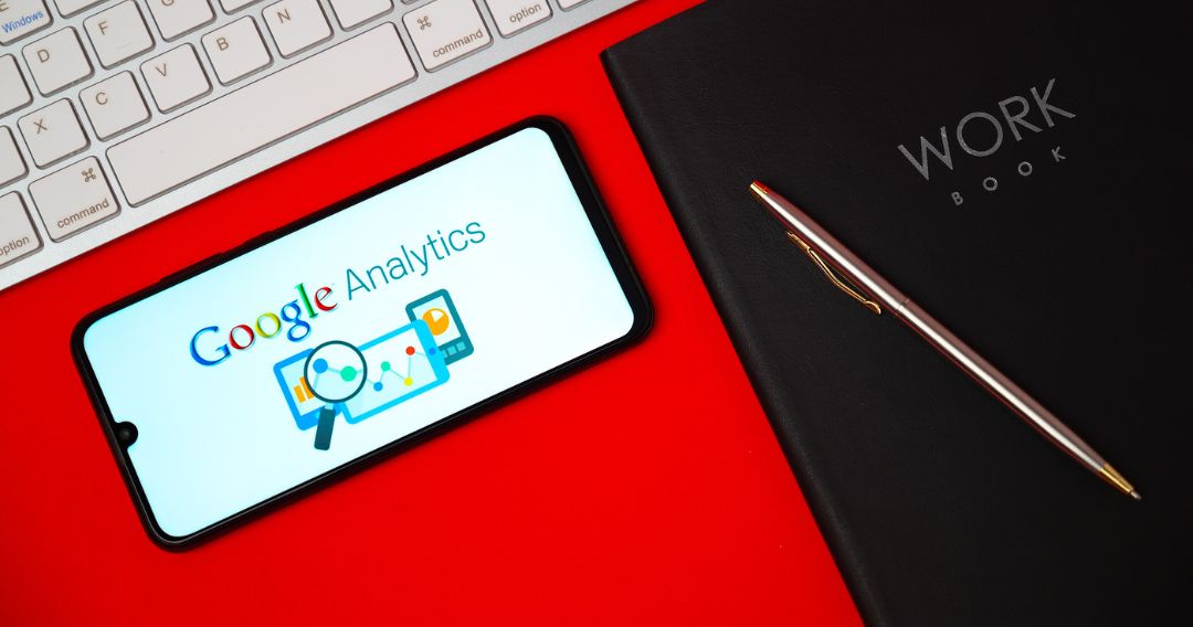 The logo of Google Analytics is seen on a smartphone screen