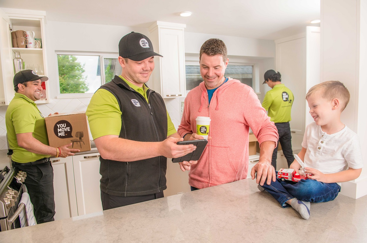 movers finalizing the work plan with a customer
