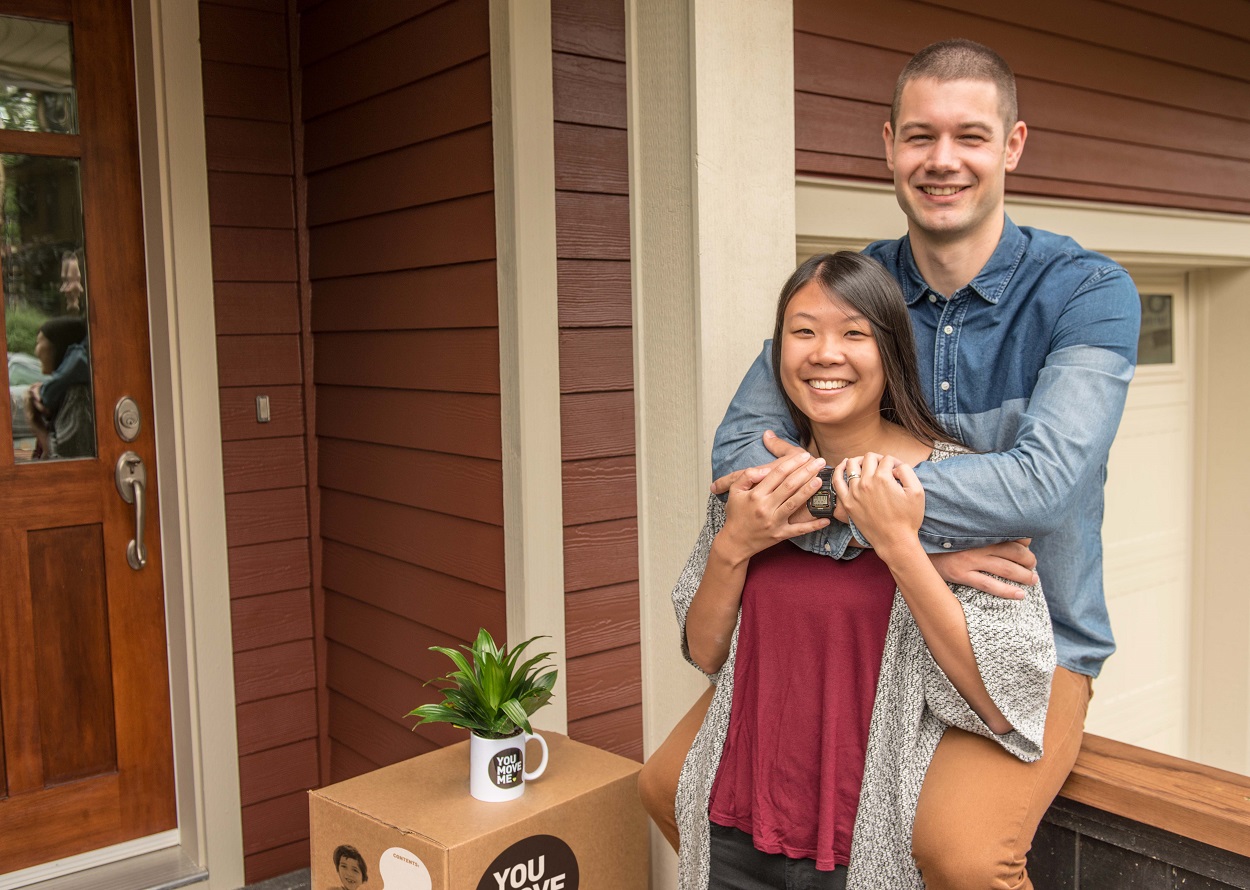 young family moving into a new home