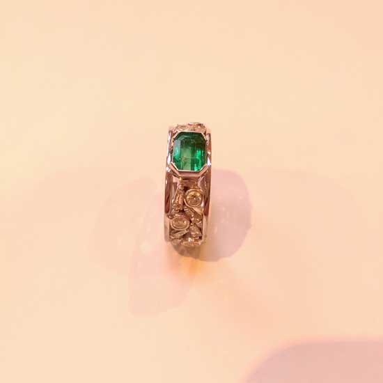 Emerald and tapered baguette diamond ring