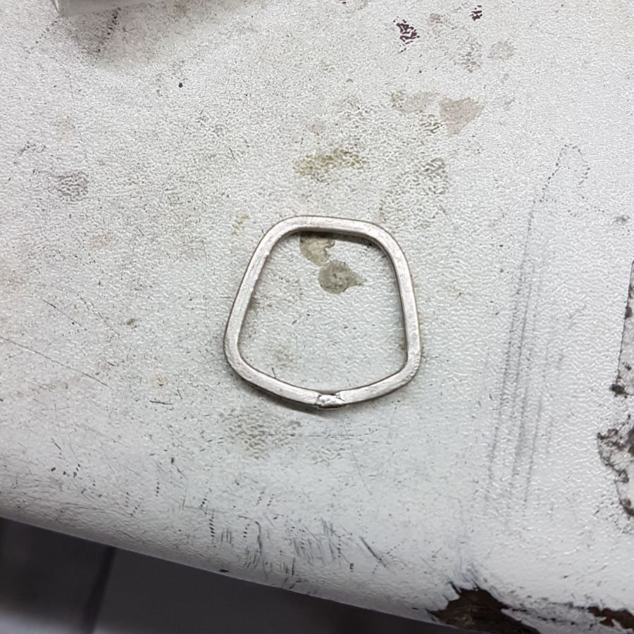 Rough trapezoid shaped wedding ring made up to check fit