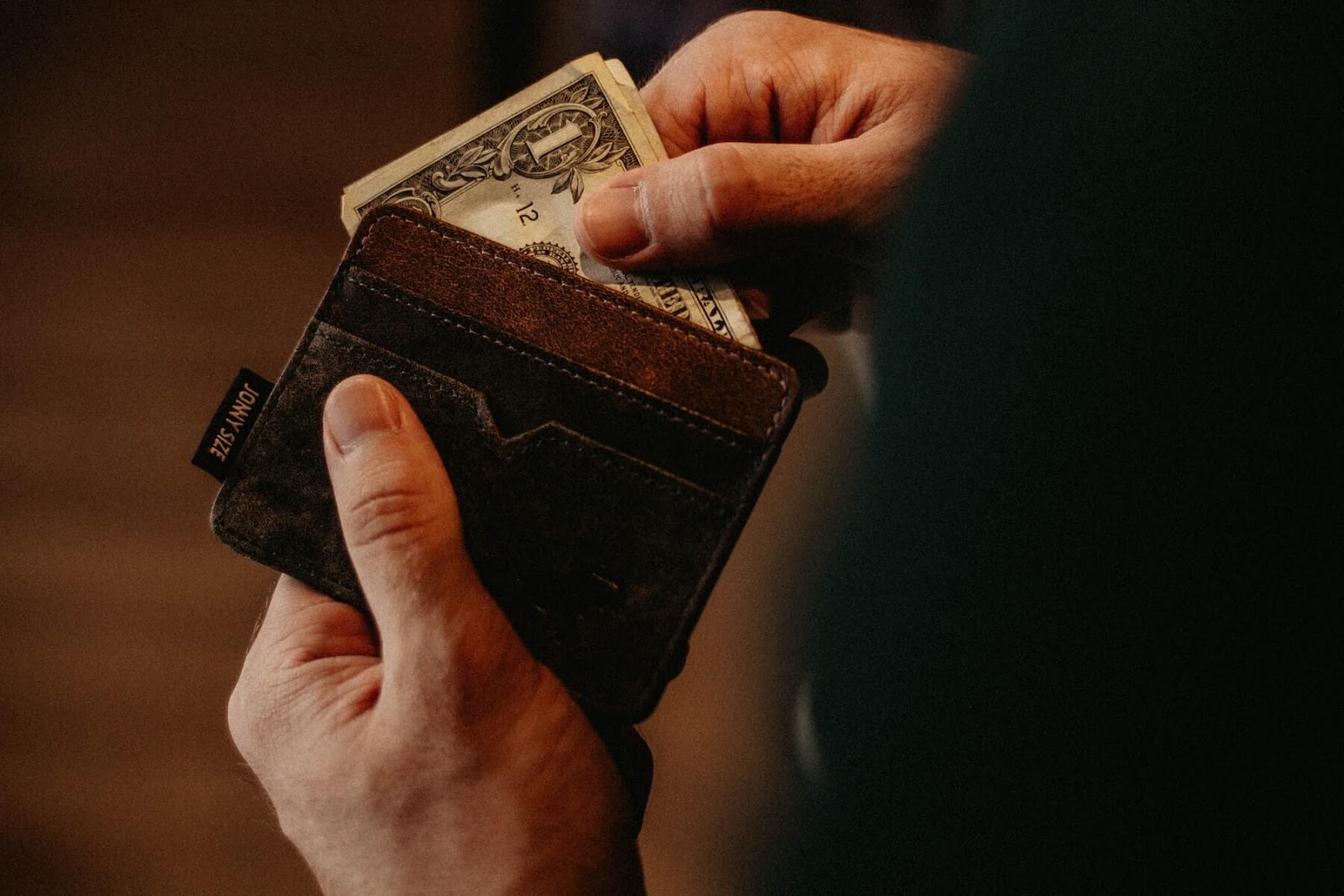 person holding a wallet