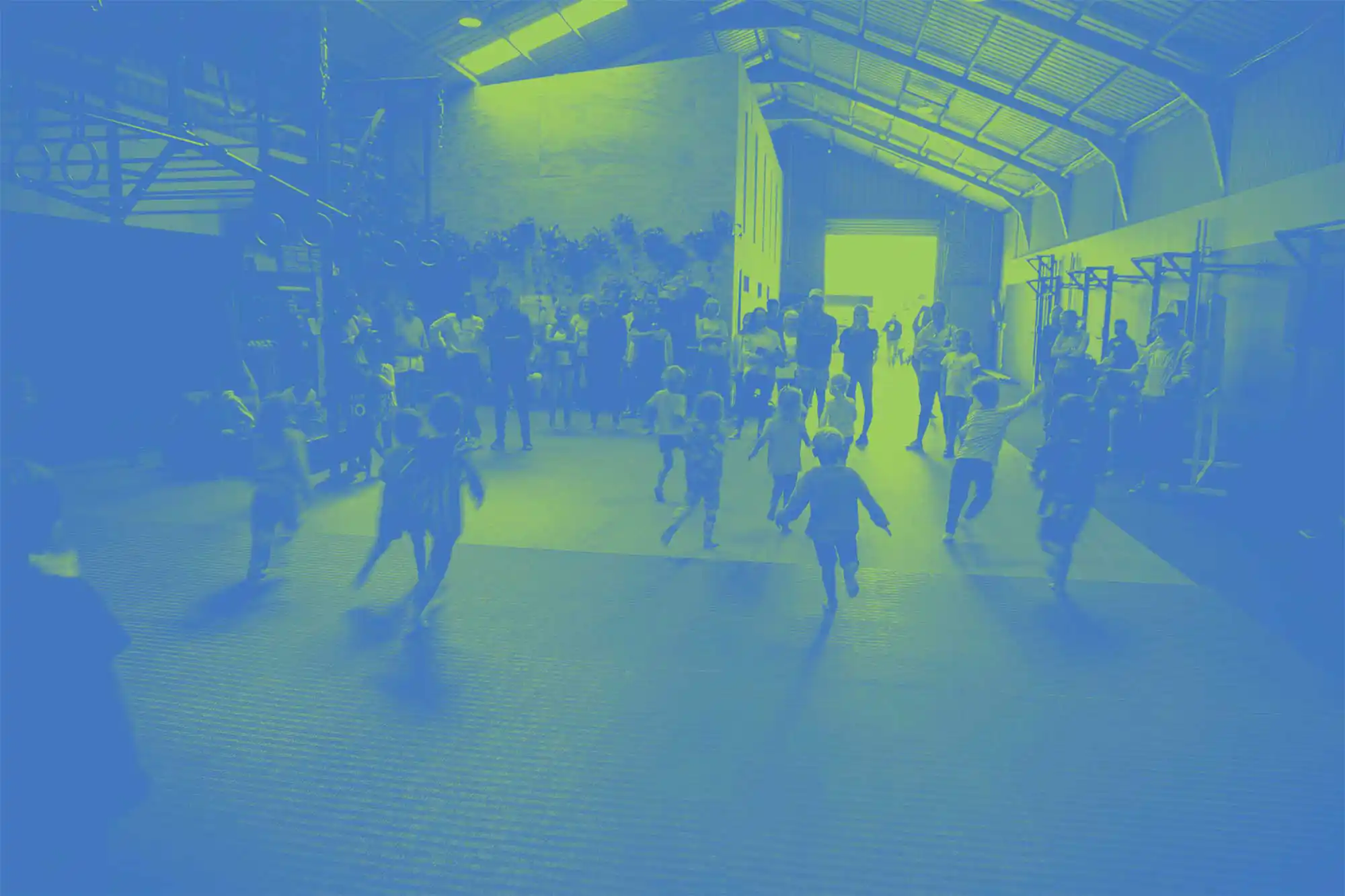 Green and blue stylised image, with children running away to their parents