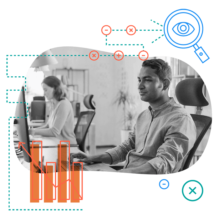 Man sitting at computer with bar charts.