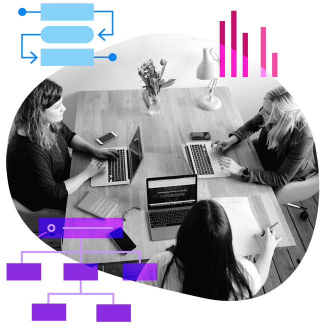 team working on laptop computers with graphs and a flowchart around them