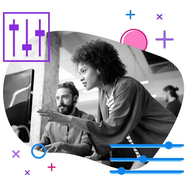 black female and male colleague working at the computer