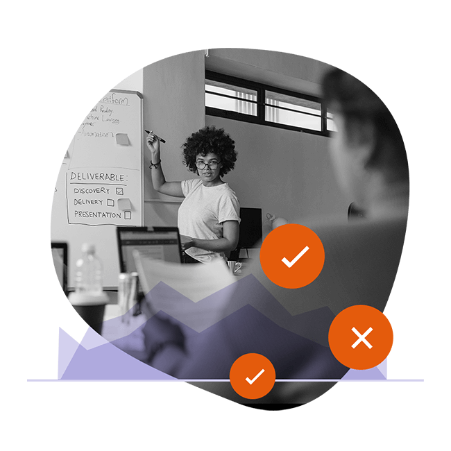 Woman writing on white board