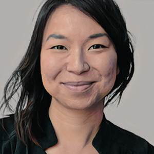 asian young female with dark hair with a warm smile