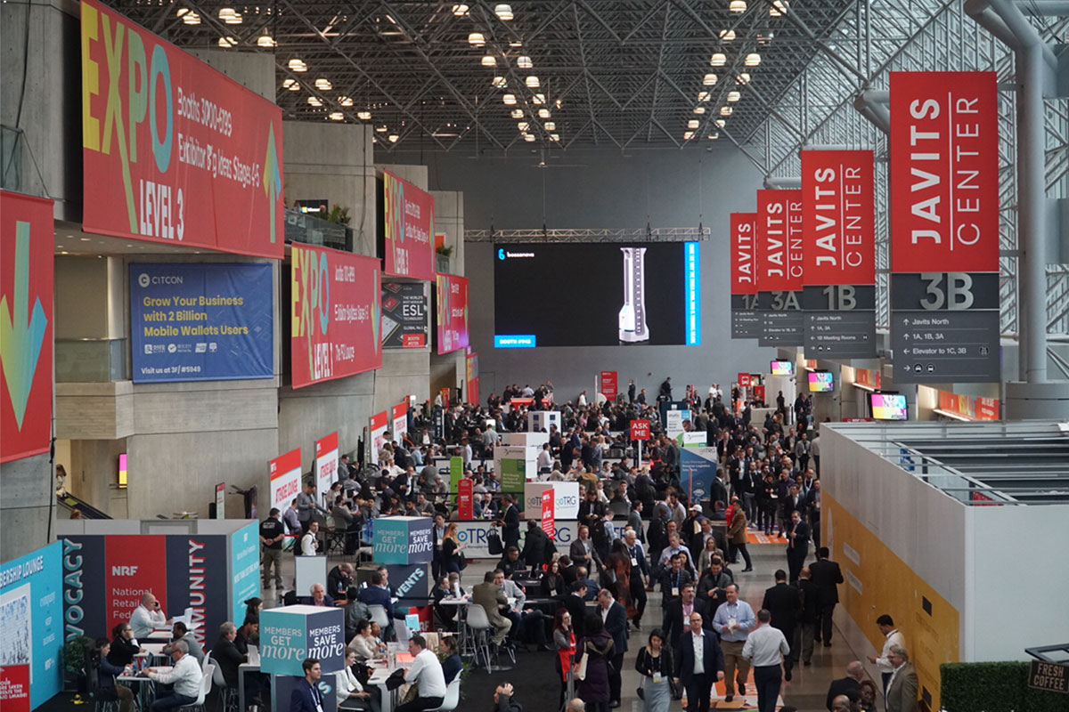 NRF 2020 hallway filled with people and tradeshow booths.
