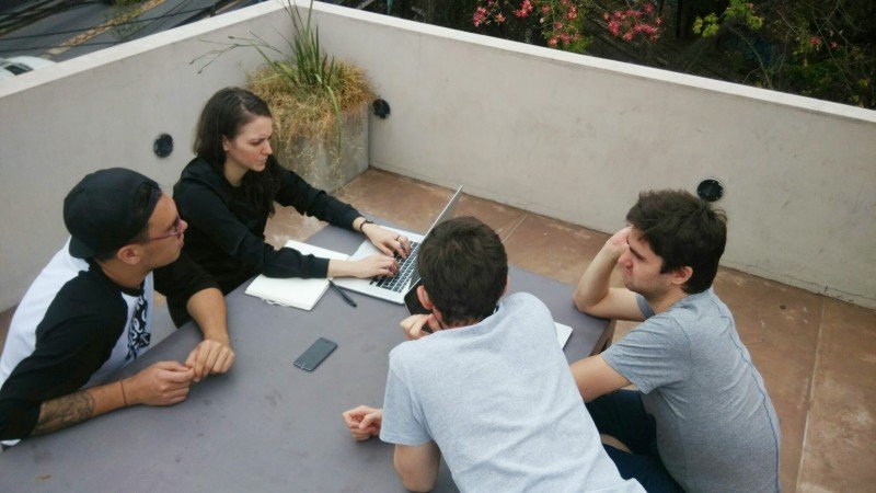 Team meeting at a table outside
