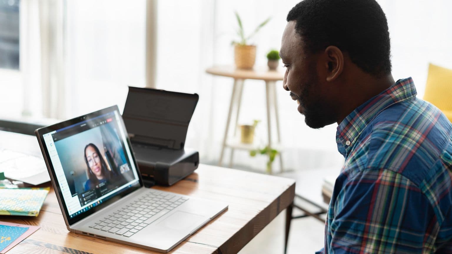 A man in a virtual meeting