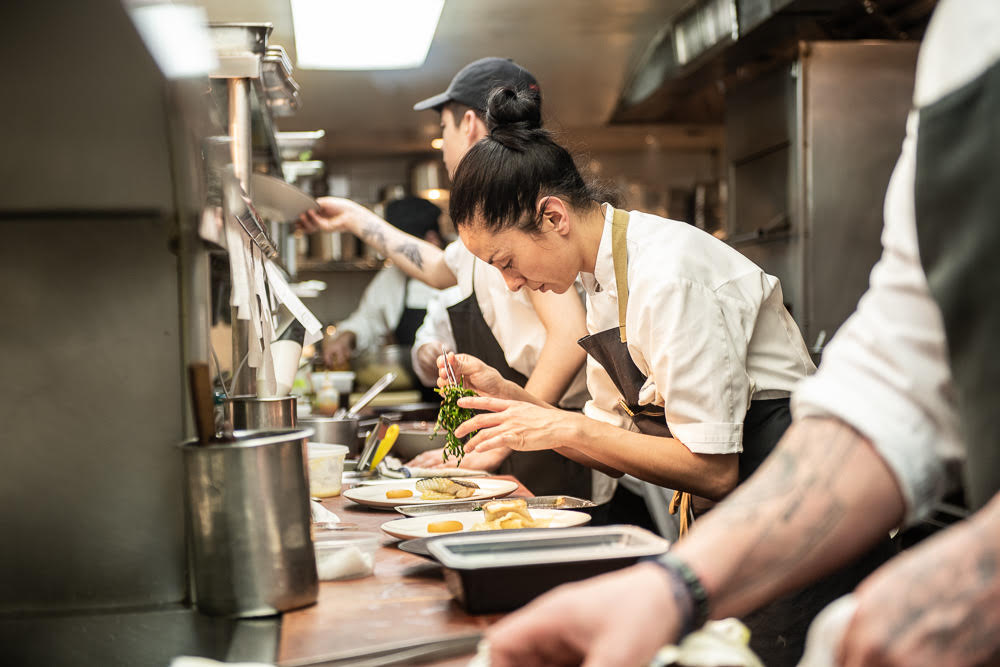group of people doing plating on serving dishes