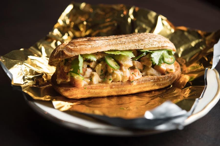 lobster eclair, placed on a foil and a plate