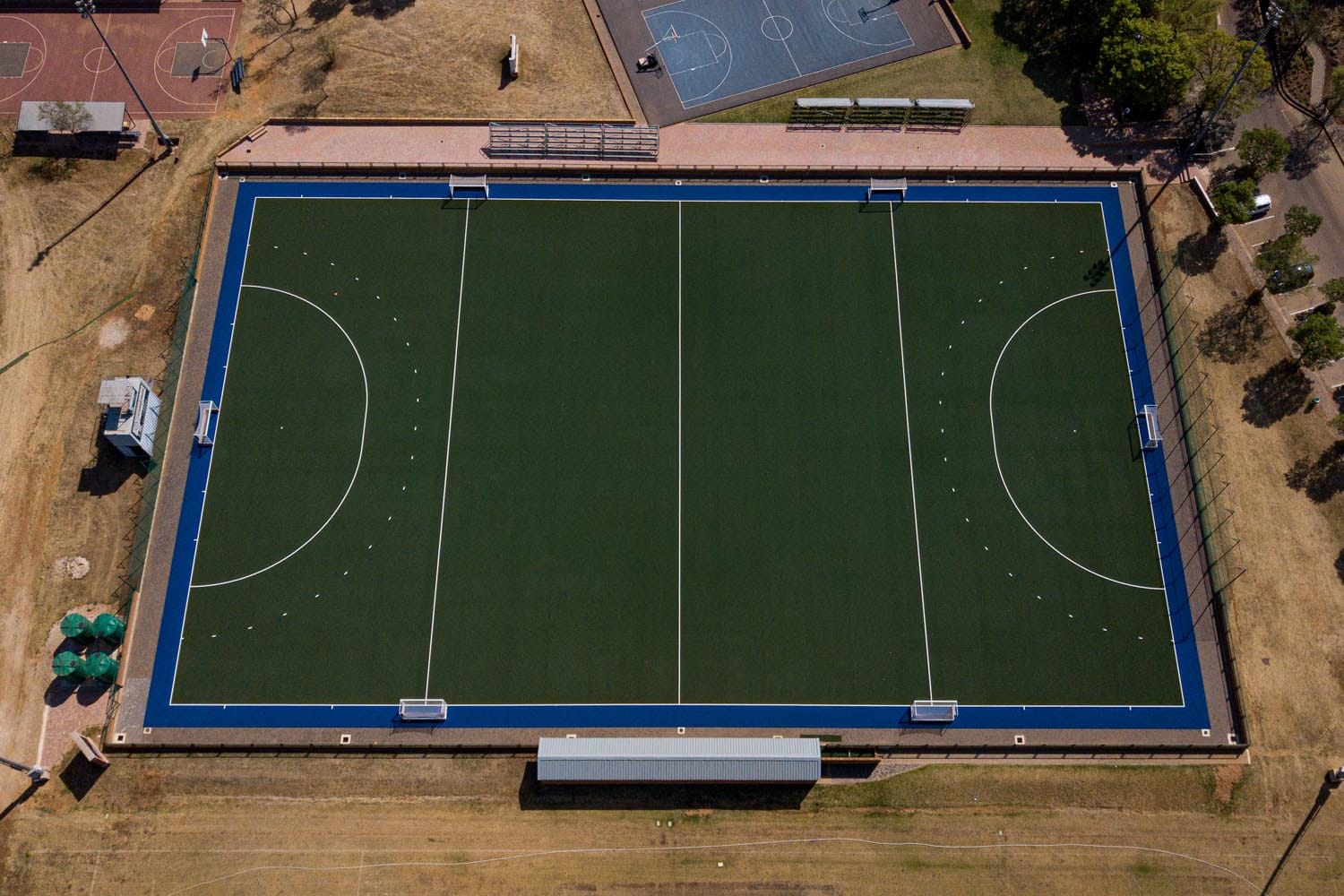 Green astro turf hockey field by Belgotex Sport