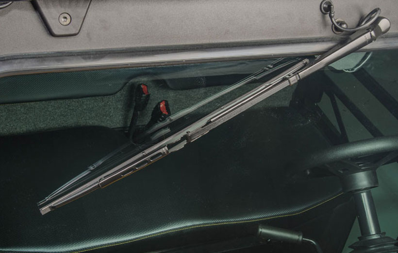 Image of a windshield wiper on a utility vehicle windshield.