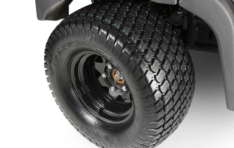 Image of the front tire of a utility vehicle on a white background.