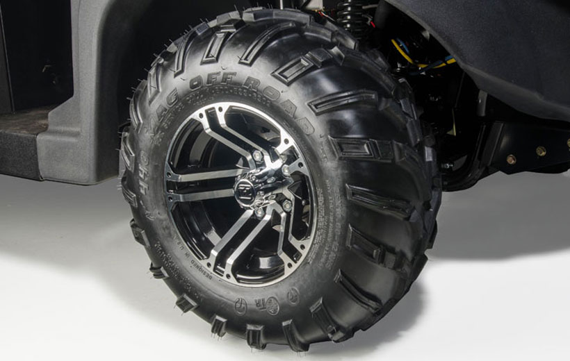 Image of a tire of a utility vehicle on a white background.