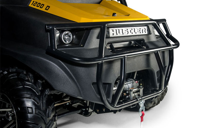 Image of the front of a utility vehicle showing the bars of a brush guard mounted to it.