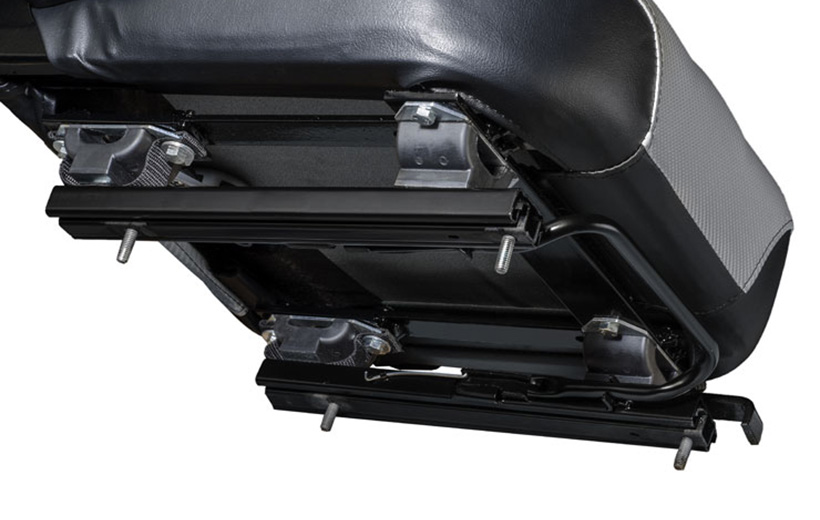 Image of the underside of a mower seat showing a set of rails with offset stands between the seat and rails