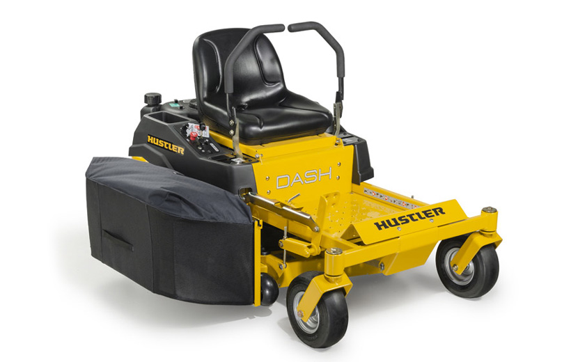 Image of yellow mower with grass bagger mounted to the side of the deck.