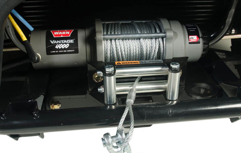Image of a winch mounted to the front of a utility vehicle.