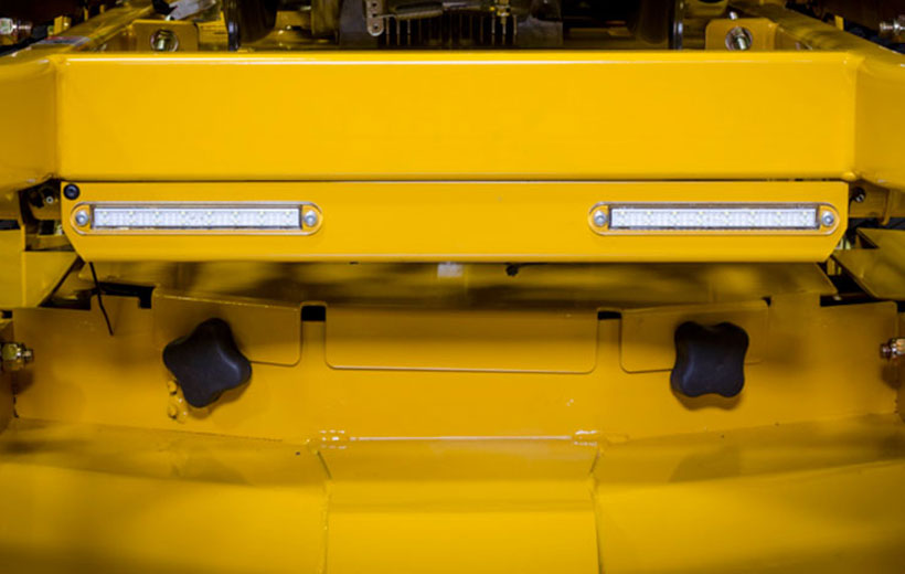 Image of the front of a mower with light bars mounted below the frame