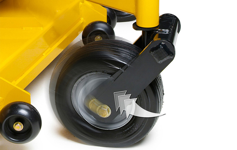 Image of black fork holding tire with motion blur with an arrow pointing in direction of motion left