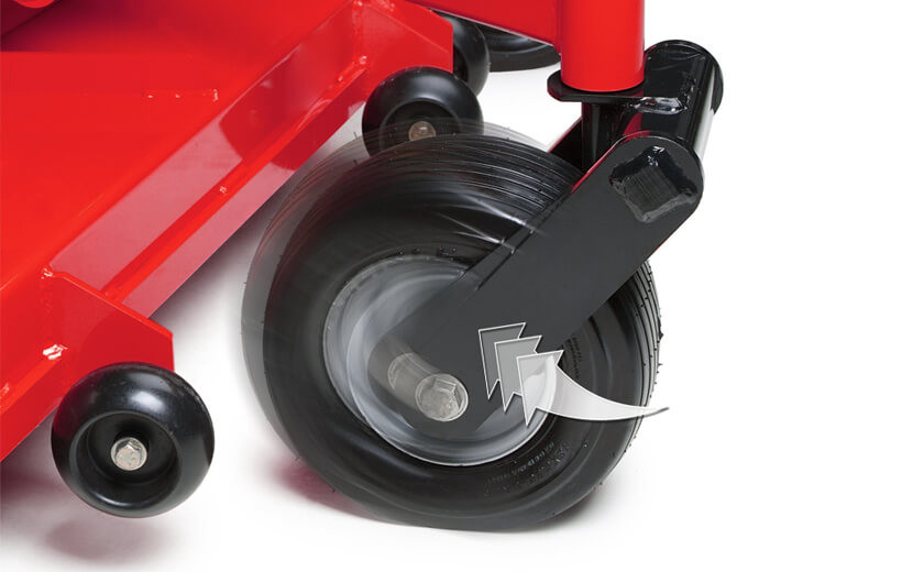 Image of a black front fork with the front tire mounted on a red riding mower