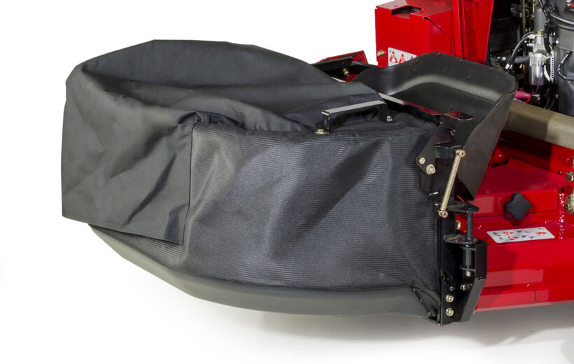 Image of mesh fabric bag mounted to the side of a mower deck