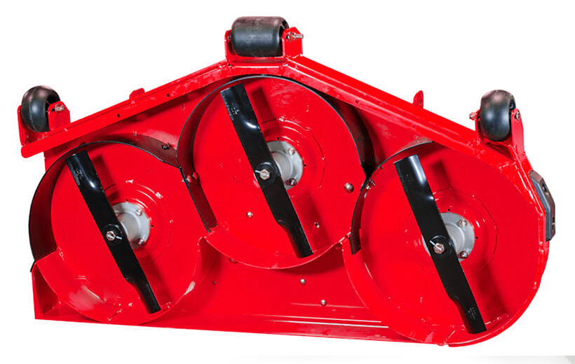 The underside of a red mower deck with black curved pieces surrounding one side of the blades