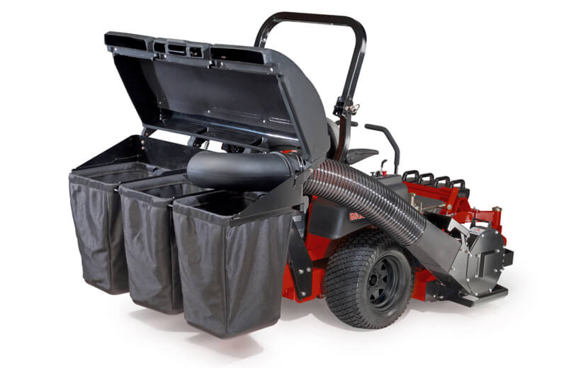 Image of the back of a mower with a black 3 bag catcher mounted to the back.