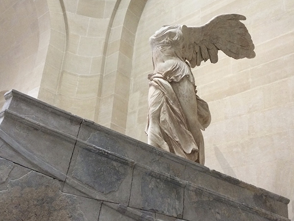 Photo of the Winged Victory of Samothrace at the Louvre.