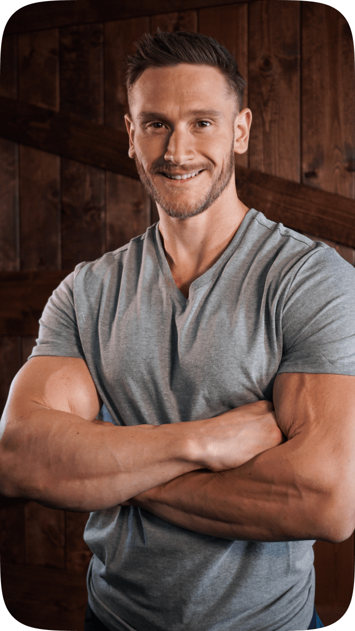 Photo of Thomas DeLauer standing in front of a wood paneled background.