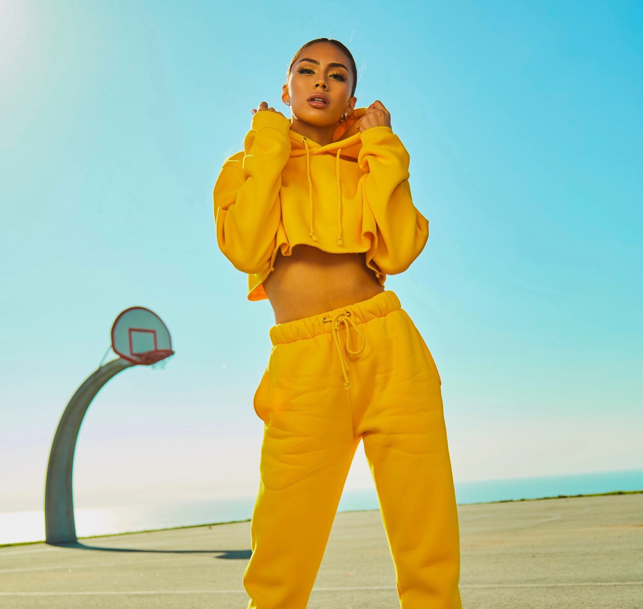 beauty school student in yellow hoody