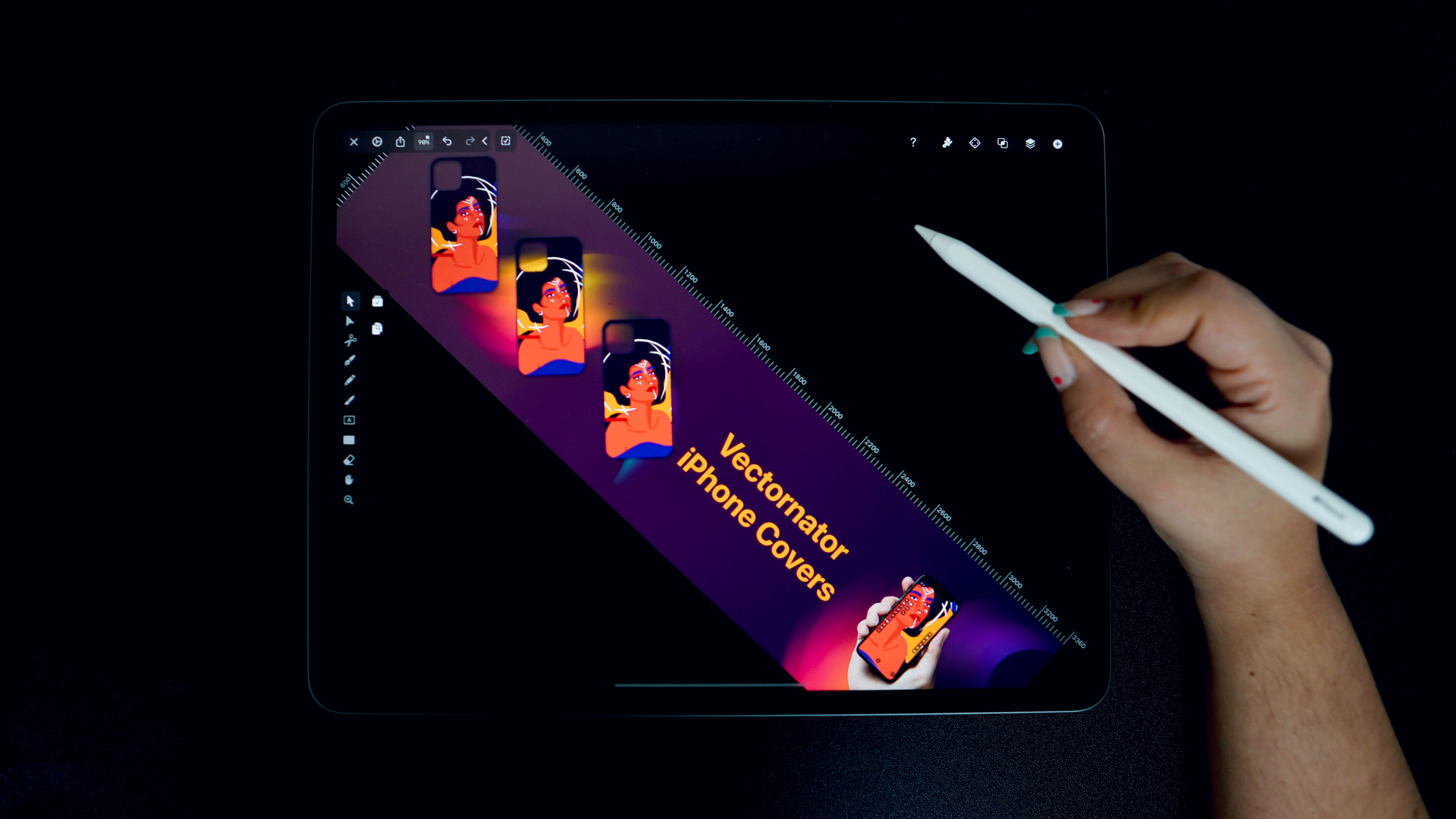 Hand holding a stylus over a tablet displaying a graphic design project