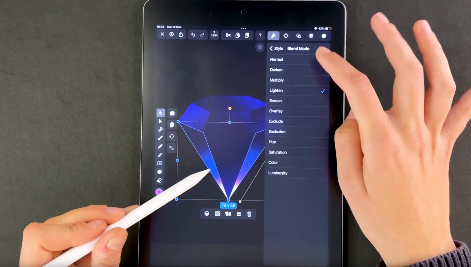 Hands interacting with blending mode settings on a diamond graphic on a tablet