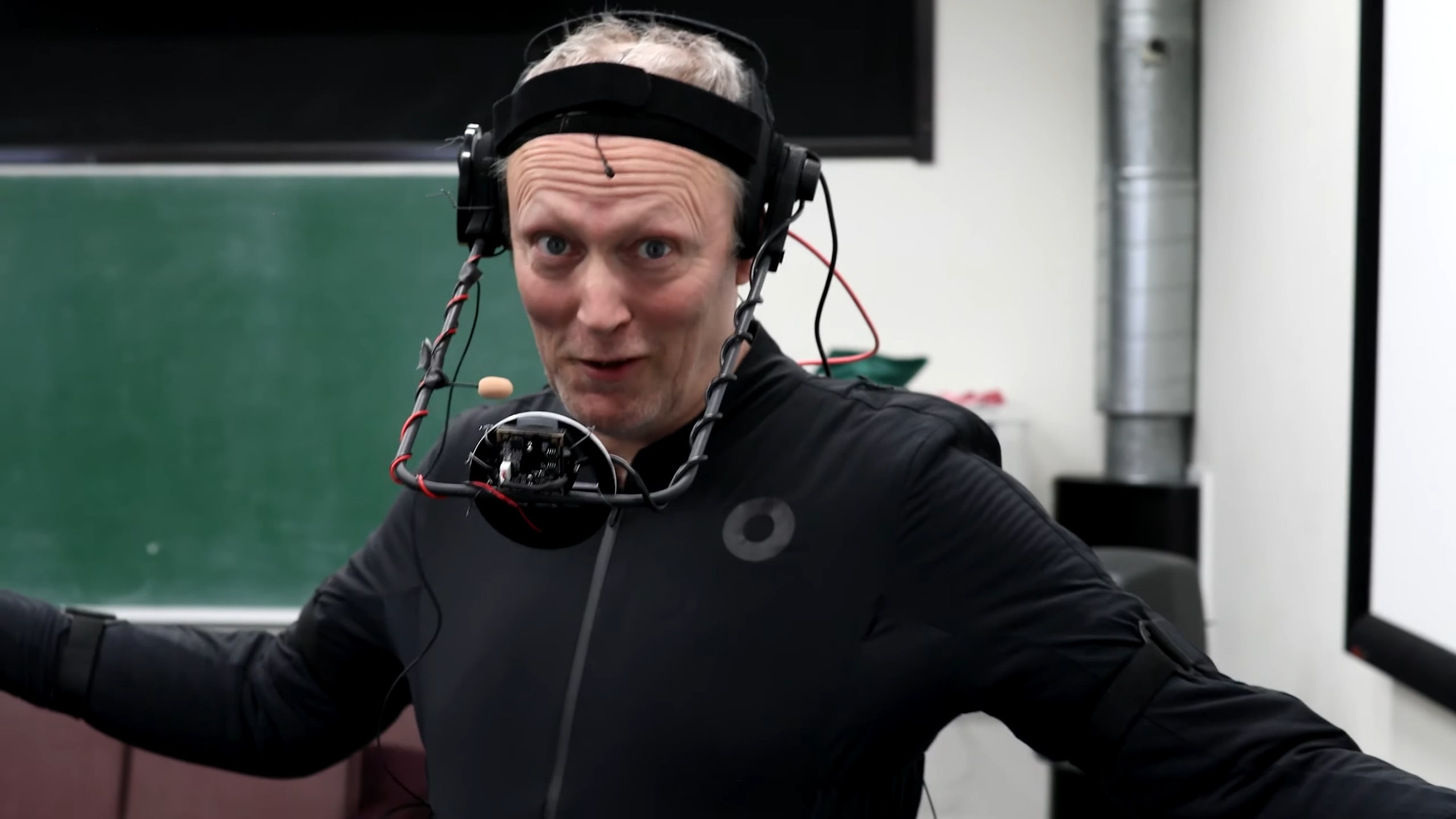 Actor Lars Mikkelsen performing a motion capture scene with a Smrtsuit Pro and advanced face tracking device