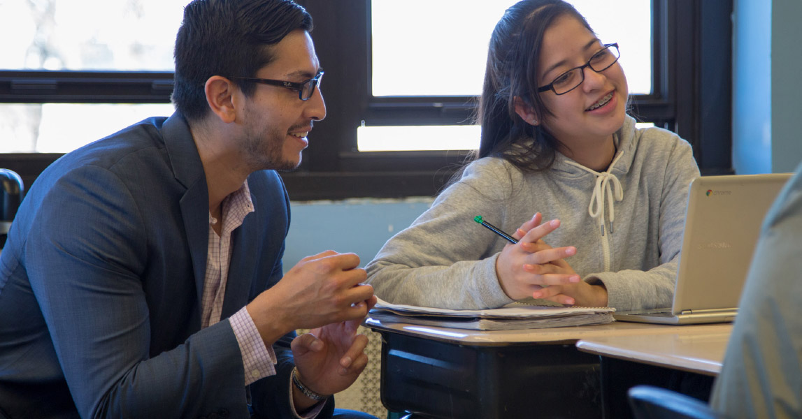 Teacher talking to student