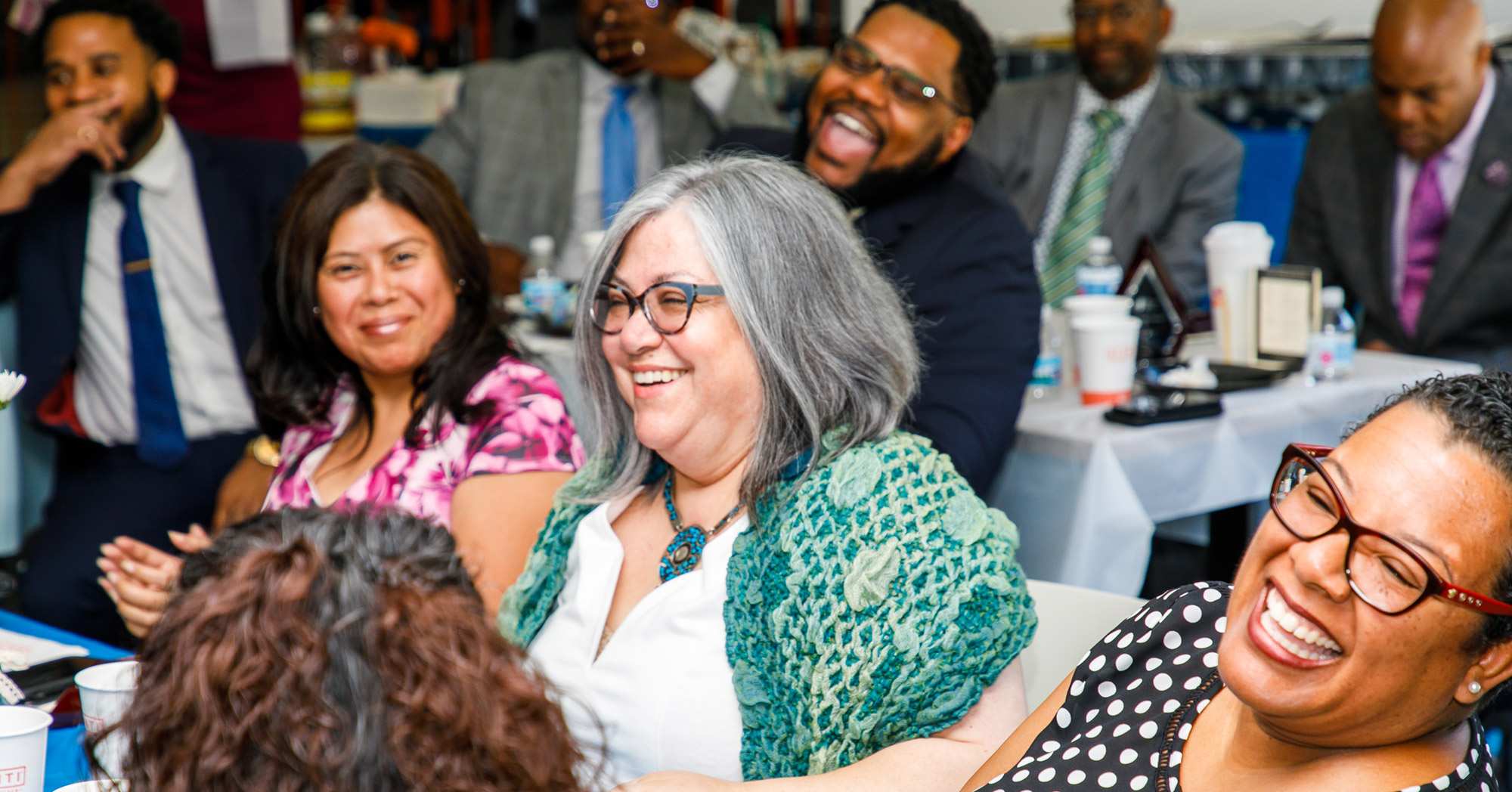 Group of people smiling and laughing