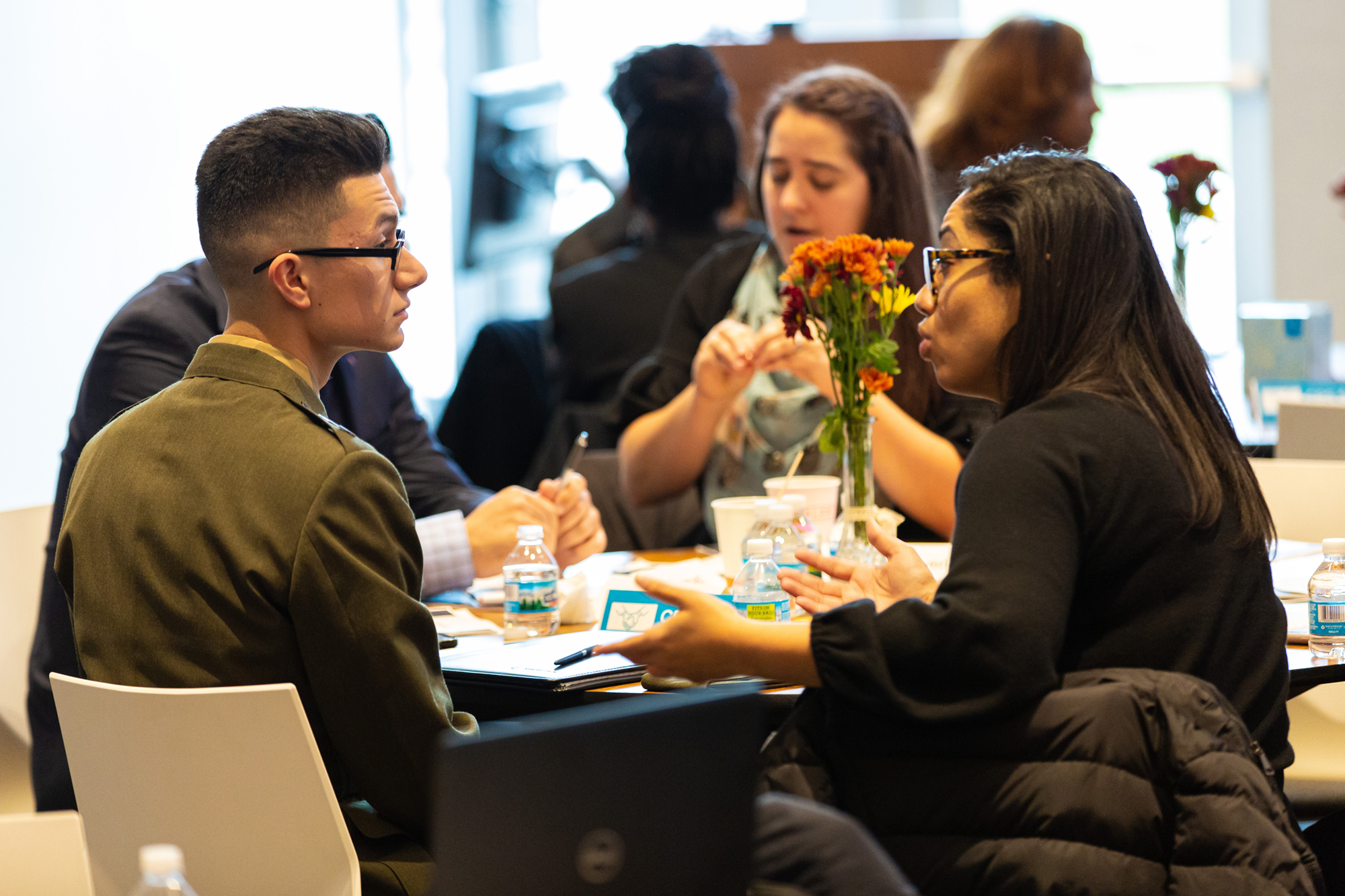 People sitting around table at a conference