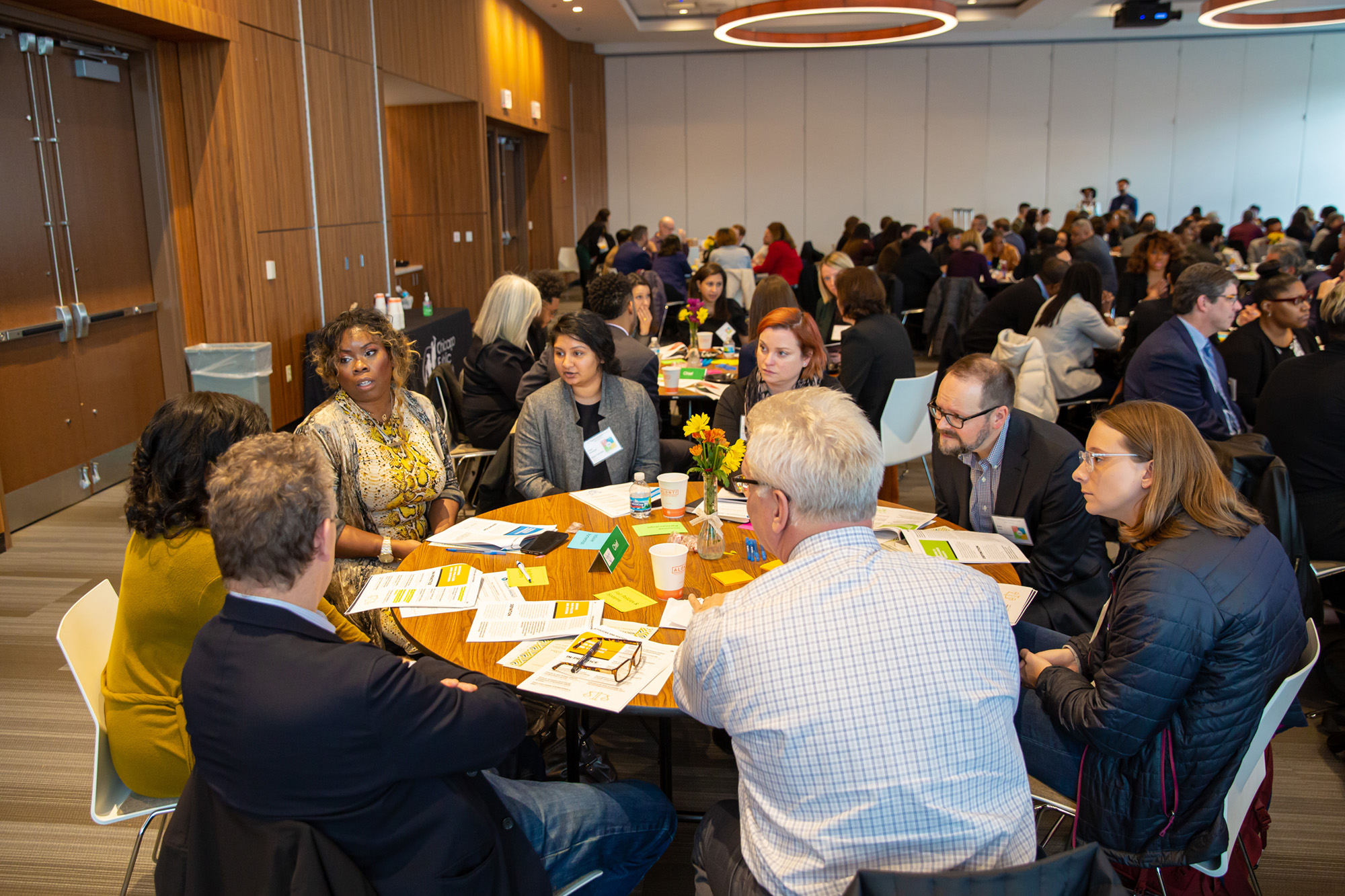 People sitting around table at a conference