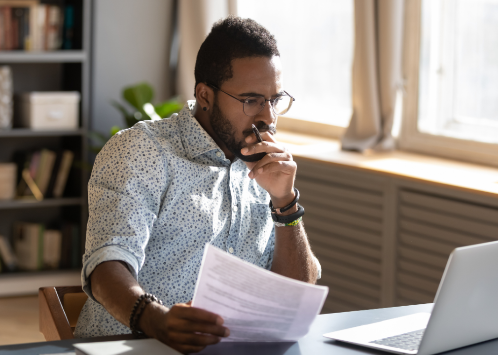 An employee reviewing onboarding documentation