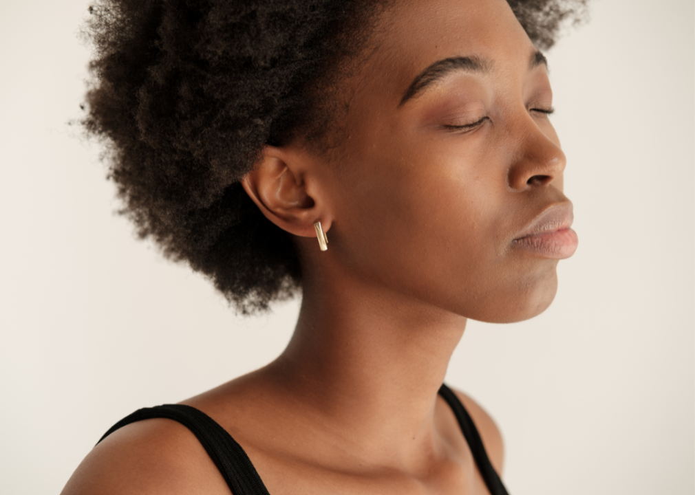 A woman listening with eyes closed