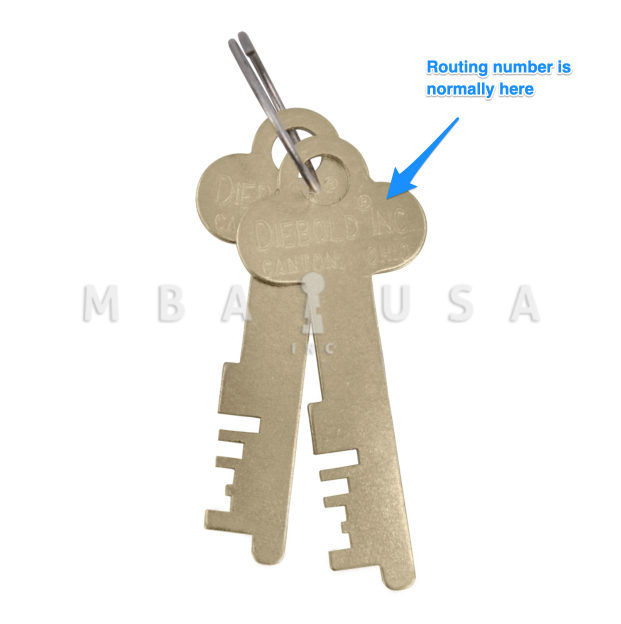 two golden safe deposit box keys