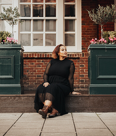 Woman Sitting On Stoop