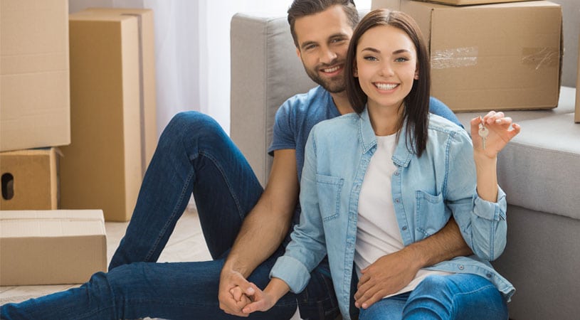 Couple Prepared For Move Using A Moving Overseas Checklist