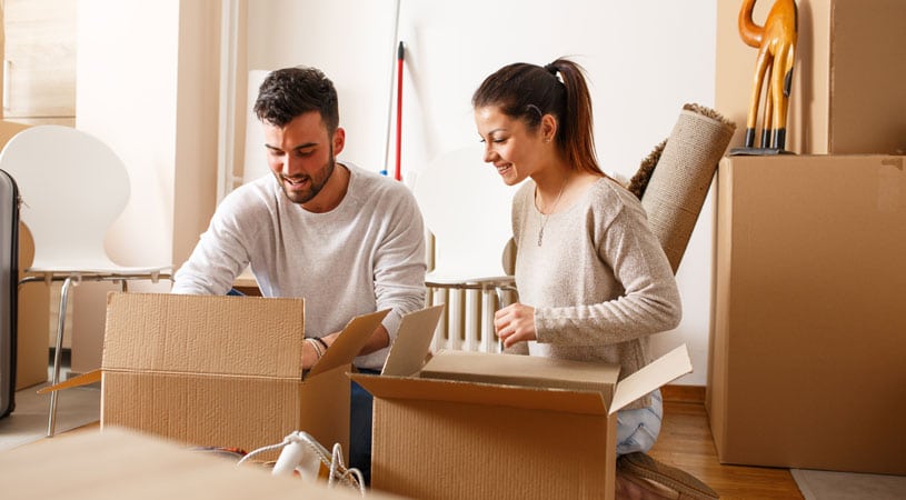 Couple Packing Their Belonging For International Removalist