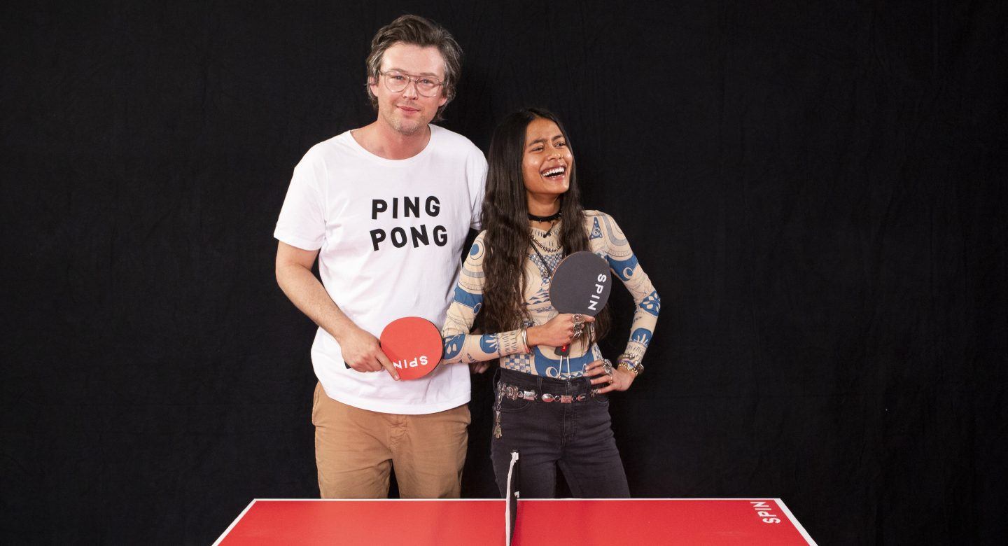 Arpana Rayamajhi and Jonathan Bricklin pose with ping pong paddles