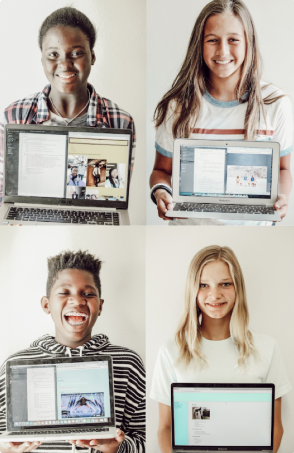 Four kids holding computers.