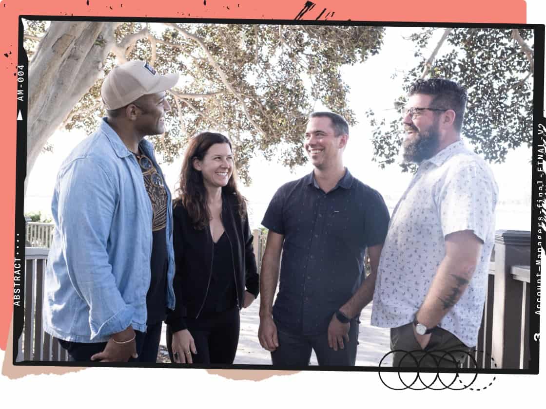 Account Managers and Design Advocates talking and laughing outside.
